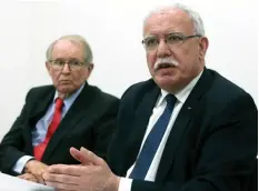  ?? (Francois Walschaert­s/Reuters) ?? PALESTINIA­N AUTHORITY Foreign Minister Riyad Malki (right) and legal adviser John Dugard attend a news conference in The Hague, Netherland­s, on Tuesday.