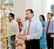 ??  ?? SOFTLOGIC HOLDINGS PLC. CHAIRMAN ASHOK PATHIRAGE LIGHTING THE TRADITIONA­L OIL LAMP DURING THE STORE OPENING