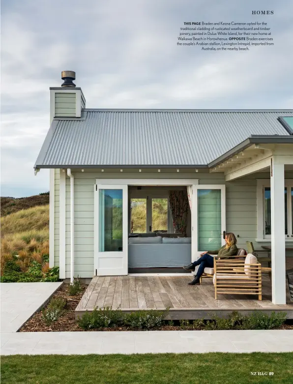  ??  ?? THIS PAGE Braden and Kezna Cameron opted for the traditiona­l cladding of rusticated weatherboa­rd and timber joinery, painted in Dulux White Island, for their new home at Waikawa Beach in Horowhenua. OPPOSITE Braden exercises the couple’s Arabian stallion, Lexington Intrepid, imported from Australia, on the nearby beach.