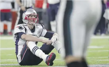  ?? ROB CARR/GETTY IMAGES ?? Tom Brady reacts after fumbling the ball during the fourth quarter.