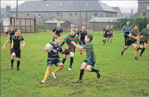  ??  ?? Oban Lorne and Mid Argyll played some entertaini­ng rugby in ‘dreich’ weather conditions.