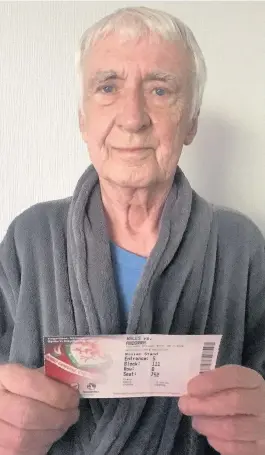  ??  ?? > Jonny’s father, Brian, with his ticket for the last Wales game he went to