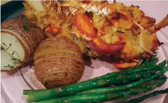  ??  ?? ABOVE: The Watson Boutique B&B is one of many newly re- opened accommodat­ions. Photo by Priscilla Romano BELOW: Lobster tail with Hasselback potatoes and asparagus. Photo courtesy of Renee’s Catering