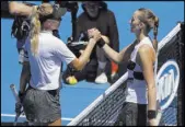  ?? Mark Schiefelbe­in The Associated Press ?? Petra Kvitova, right, shakes hands with Amanda Anisimova after romping to a 6-2, 6-1 victory in 59 minutes in the fourth round of the Australian Open.
