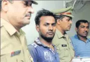  ?? SUNIL GHOSH /HT PHOTO ?? Police officials said Sudheer Bhagat (centre), who was arrested in Noida, had been on the run over more than 11 years and carried a reward of ₹50,000 for his arrest.