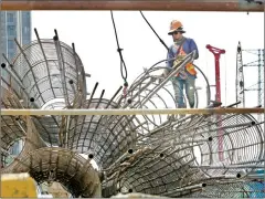  ?? HENG CHIVOAN ?? A constructi­on worker prepares rebar cages for the foundation of an overpass in the capital’s Meanchey district, on January 26.