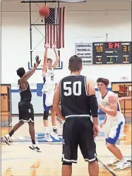  ?? Michael Baron ?? Kade Steward goes up for a 3-point shot attempt against the Cornerston­e Prep Cougars during the Thanksgivi­ng Tournament at Gordon Central High School on Tuesday.