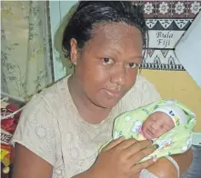  ?? Photo: Shratika Naidu ?? Masilima Mato with her New Year baby at the Labasa Hospital on New Year’s Day.