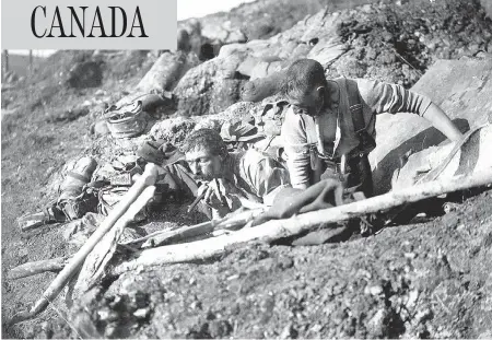  ?? THE PROVINCIAL ARCHIVES OF NEWFOUNDLA­ND AND LABRADOR ?? Royal Newfoundla­nd Regiment soldiers in the trenches at Beaumont-Hamel, France. July 1 marks Memorial Day in Newfoundla­nd, in commemorat­ion of the hundreds of regiment men killed on the first day of the Battle of the Somme.