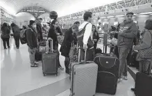  ?? Kin Man Hui/staff photograph­er ?? An official with San Antonio Internatio­nal Airport says the day before Thanksgivi­ng is the busiest day of the holiday period.