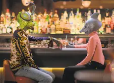 ?? Netflix ?? Two disguised participan­ts break the ice over drinks in the new dating show “Sexy Beasts.”