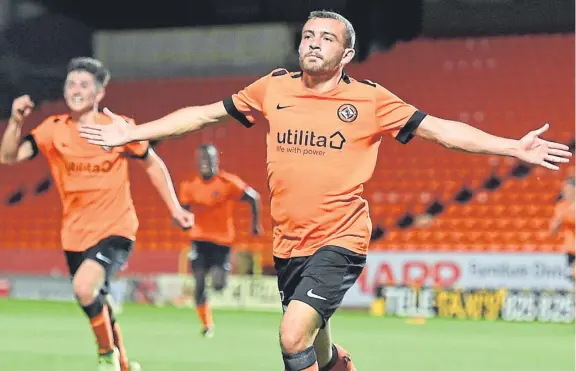  ?? Picture: SNS Group. ?? Paul Mcmullan celebrates after netting United’s winner in last night’s tie at Tannadice.