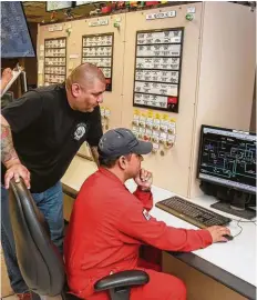  ?? Gary Fountain ?? Jacob Partida and Javier Duarte monitor operations at Ascend Performanc­e Materials’ plant in Alvin.