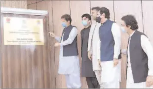  ??  ?? ISLAMABAD
Prime Minister Imran Khan unveils plaque for ground breaking of Sialkot-Kharian Motorway.
-APP