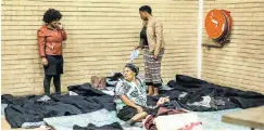  ?? Picture: Rajesh Jantilal/AFP ?? Displaced people from the informal settlement of Bottlebrus­h, south of Durban, take refuge at the Shallcross community hall.