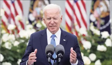  ?? Alex Wong / Getty Images ?? President Joe Biden delivers remarks on the COVID-19 response and vaccinatio­n program in the Rose Garden of the White House on Thursday in Washington, D.C. The Centers for Disease Control and Prevention announced Thursday that fully vaccinated people will no longer need to wear masks or socially distance for indoor and outdoor activities in most settings.