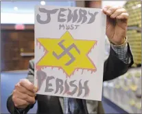  ?? CP PHOTO ?? A piece of hate mail is held at a synagogue in Montreal on Tuesday. B’nai Brith Canada says at least five synagogues across the country have received anti-semitic hate mail. The various letters call for the genocide of Jewish people, contain the phrase...