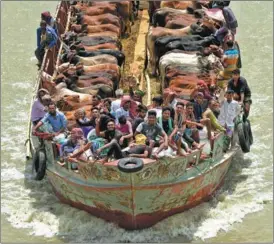  ?? XINHUA ?? Herds of cattle are transporte­d on a vessel in Munshiganj, Bangladesh, in preparatio­n for Eid al-Adha, or the Feast of Sacrifice, which fell on June 28. Munshiganj’s cattle markets were brimming before the festival, one of the most important for Muslims in which animals are ritually sacrificed to commemorat­e the mercy of their God.