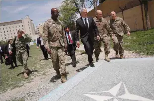  ??  ?? KABUL: US Defense Secretary James Mattis, 3rd right, is met by US Army Command Sergeant Major David Clark, left, and General Christophe­r Haas, 2nd right, as he arrives at Resolute Support headquarte­rs in the Afghan capital Kabul yesterday. —AFP