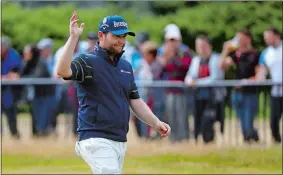  ?? PETER MORRISON/AP PHOTO ?? South Africa’s Branden Grace waves to the gallery as he makes his way along the 18th fairway during the third round of the British Open on Saturday at Royal Birkdale in Southport, England. Grace became the first player in major history to shoot a 62.