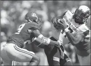  ?? AP/BRYNN ANDERSON ?? Alabama defensive back Minkah Fitzpatric­k sacks Kent State quarterbac­k Mylik Mitchell during Saturday’s game. The top-ranked Crimson Tide blew past the Golden Flashes 48-0.