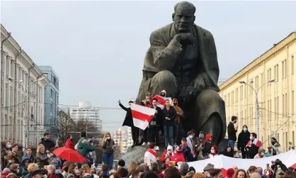  ?? Photograph: TASS ?? Opposition supporters take part in a rally by a monument to Belarusian poet Yakub Kolas in Minsk, Belarus.