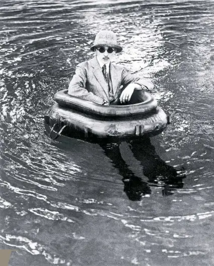  ??  ?? Jacques Lartigue's older brother, Maurice, floats in an inner tube outfitted with rubber legs. Jacques’ late Belle Epoque photograph­s go on display at The Frick Pittsburgh today.