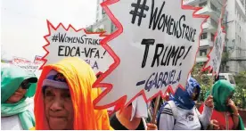  ?? Picture: AP ?? MARCHING ON: Filipino women display placards as they march during a rally at the US embassy to mark Internatio­nal Women’s Day in Manila, Philippine­s.