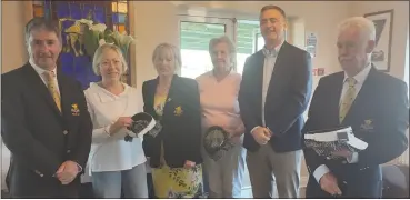  ?? ?? Ladies team winners Caitlin Fitzgerald and Marie Keating receiving their prizes from Gary Morrison, Morrison BMW sponsors, captain John Hughes, captain Mary Lyons and president Paul Adamson. (Missing from photo is Michelle Keating).