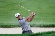  ?? AP Photo/Darron Cummings ?? ■ Coilin Morikawa hits from a bunker on the 18th hole during opening round of the Workday Charity Open golf tournament Thursday in Dublin, Ohio.