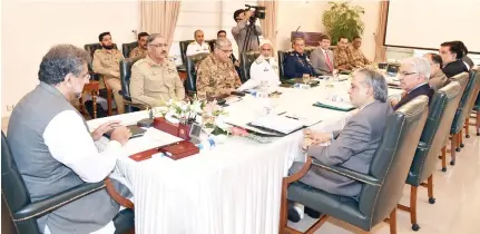  ??  ?? Prime Minister Shahid Khaqan Abbasi, left, heads a meeting of the National Security Committee in Islamabad, Pakistan, Thursday. (AP)