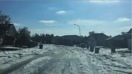  ?? JANA SMITH ?? Moose Jaw was hit with a downpour early Wednesday that resulted in parts of the city being covered with several inches of hail. Environmen­t Canada had issued a severe thundersto­rm watch for southern Saskatchew­an on Tuesday, which indicated the storm...