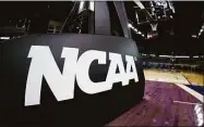  ?? Maddie Meyer / TNS ?? The NCAA logo is seen on the basket stanchion before the game between the Oral Roberts Golden Eagles and the Florida Gators in the second round game of the 2021 NCAA Men's Basketball Tournament at Indiana Farmers Coliseum on March 21, 2021 in Indianapol­is.