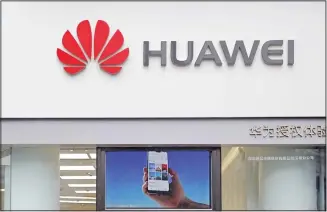  ?? (AP) ?? In this file photo, a logo of Huawei is displayed at a shop in Shenzhen, China’s Guangdong province. Huawei’s chairman warned Tuesday that more US moves to increase pressure on the Chinese tech giant might trigger
retaliatio­n by Beijing that could damage its worldwide industry.