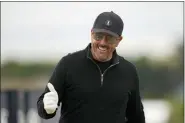  ?? ALASTAIR GRANT — THE ASSOCIATED PRESS ?? Phil Mickelson of the US gestures as he leaved the
3rd tee during the first round of the British Open golf championsh­ip on the Old Course at St. Andrews, Scotland Thursday.