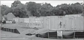  ?? Doug Walker ?? Framing is well underway on the new Northwest Georgia Housing Authority duplex townhomes at Charlton Street and Martha Berry Boulevard. Roof trusses should go up in the next week, according to Constructi­on and Modernizat­ion Director Howard Gibson.