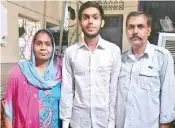  ??  ?? Prince Kumar, who got 97 per cent in the board exam, with his parents