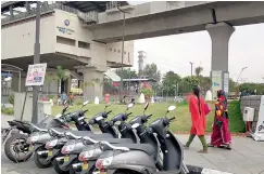  ??  ?? Gearless vehicles for rent outside Miyapur Metro station.