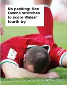  ??  ?? No peeking: Ken Owens stretches to score Wales’ fourth try