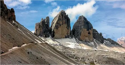  ?? PHOTOS: NEIL RATLEY/STUFF ?? The Tre Cime di Lavaredo, a trinity of towers, is the most famous landmark in the Dolomites.