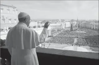  ?? THE ASSOCIATED PRESS ?? Pope Francis delivers his "Urbi et Orbi" blessing from the central balcony of St. Peter’s Basilica at the Vatican.