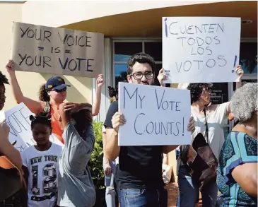  ?? PEDRO PORTAL pportal@miamiheral­d.com ?? A group of activists protested in front of the Miami-Date Elections Department on Saturday, demanding that all ballots be counted.