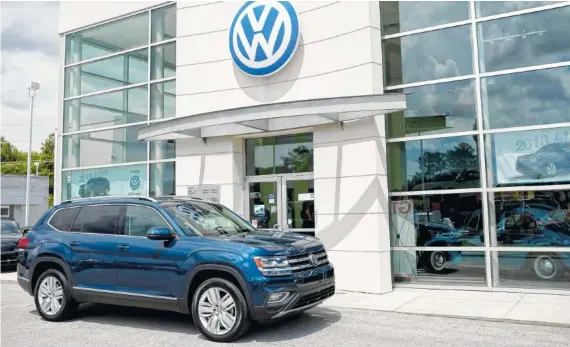  ?? STAFF FILE PHOTO BY DOUG STRICKLAND ?? A new Volkswagen Atlas SUV sits in front of Village Volkswagen. The Chattanoog­a-made Atlas helped push Volkswagen of America to a 15 percent gain in sales in June.