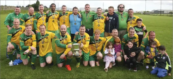  ??  ?? The Rathnew team and supporters after the Charlie Byrne Cup final victory over Dearg Celtic last Saturday afternoon in Celtic Park. Photos: Garry O’Neill