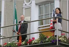  ??  ?? Good Morning America...Mayor of Killarney Municipal Area Cllr Brendan Cronin, raises the Irish flag as Kate O’Leary, President of Killarney Chamber raises the stars and stripes.