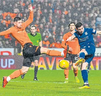  ??  ?? Graham Dorrans scores the last goal in a Dundee league derby, the 1-1 draw at Tannadice in December, 2019. The game is one of this season’s selling points in the Premiershi­p