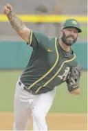  ?? AP ?? Athletics pitcher Mike Fiers had a lot of support during his first spring start, and he pitched two perfect innings.