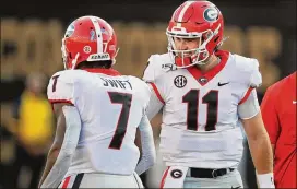  ?? CURTIS COMPTON / CCOMPTON@AJC.COM ?? Jake Fromm and running back D’Andre Swift have helped lead the Bulldogs to a 10-1 start, but there’s a tough road ahead to the playoffs.