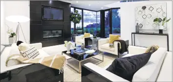  ?? Aaron Hoffman / TNS ?? Action- film star Dolph Lundgren paid $ 3.9 million for a modern mansion in the Hollywood Hills. The steel- and- glass home keeps the eyes moving with floor- to- ceiling windows and a custom floating staircase.