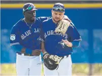  ?? RICK MADONIK/TORONTO STAR FILE PHOTO ?? Anthony Alford and Rowdy Tellez talks things over after drills at Blue Jays spring training in February.